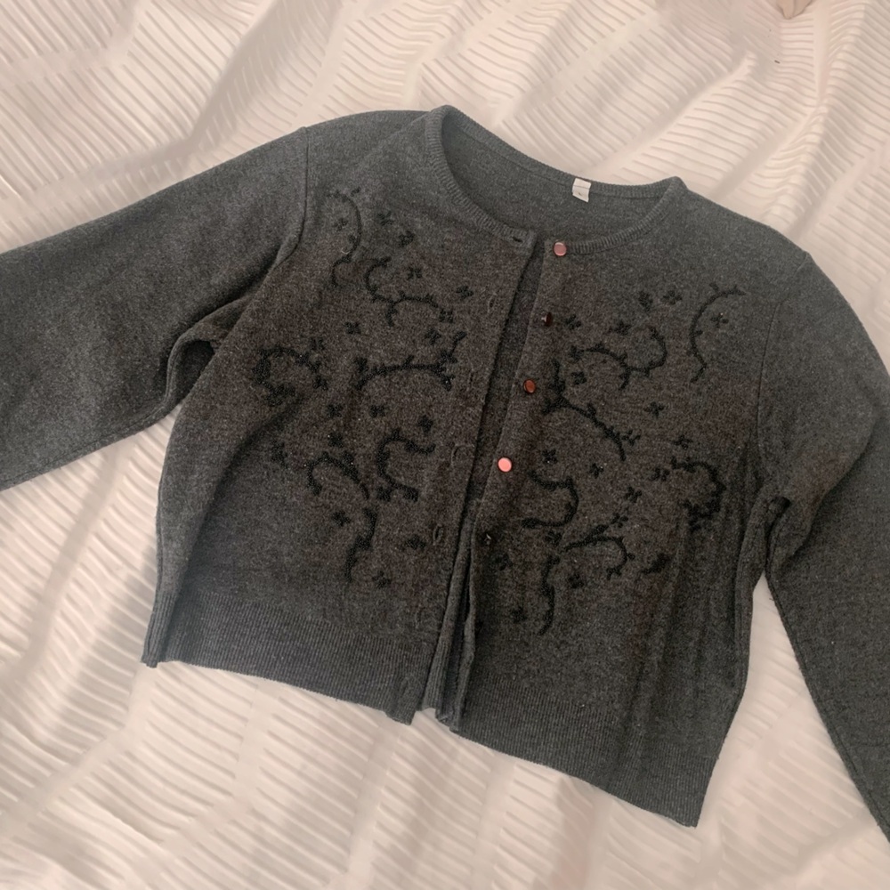 Crop sweater with beaded design.